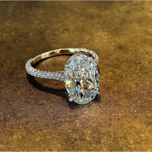 Load image into Gallery viewer, 6 Carat Oval-Cut Zircon Ring Channel Stoned on Band
