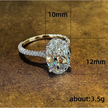 Load image into Gallery viewer, 6 Carat Oval-Cut Zircon Ring Channel Stoned on Band
