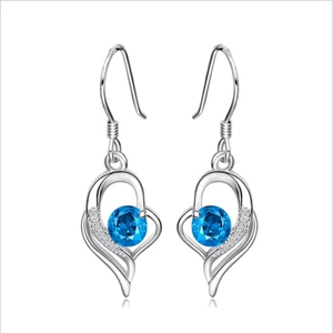 Sterling silver earrings with heart design and blue crystal stones.