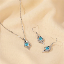 Load image into Gallery viewer, Silver-tone necklace and earring set with blue faux crystal pendant.
