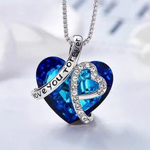 Load image into Gallery viewer, Ocean blue crystal heart necklace with &#39;I love you forever&#39; detail and sterling silver plating.
