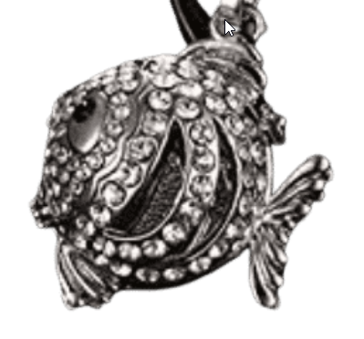 Close-up of a rhinestone-covered fish pendant.