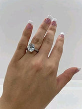 Load image into Gallery viewer, 6 Carat Oval-Cut Zircon Ring Channel Stoned on Band
