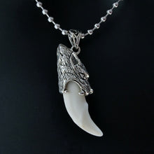 Load image into Gallery viewer, Stainless steel wolf tooth pendant necklace, featuring a detailed wolf head and smooth, white tooth.
